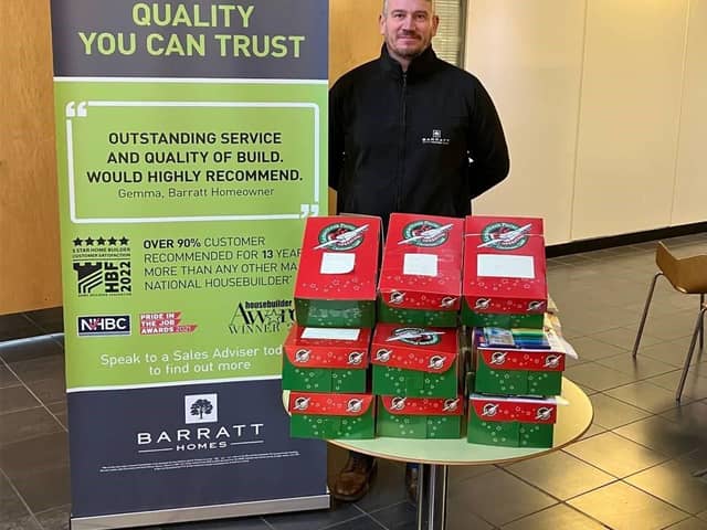 Managing Director Gary Chambers with the shoeboxes