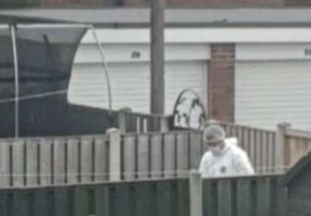 A man has been left with stitches in his head after a suspected stabbing on a Sheffield estate. Police scene of crime officers are pictured at Landseer Road.