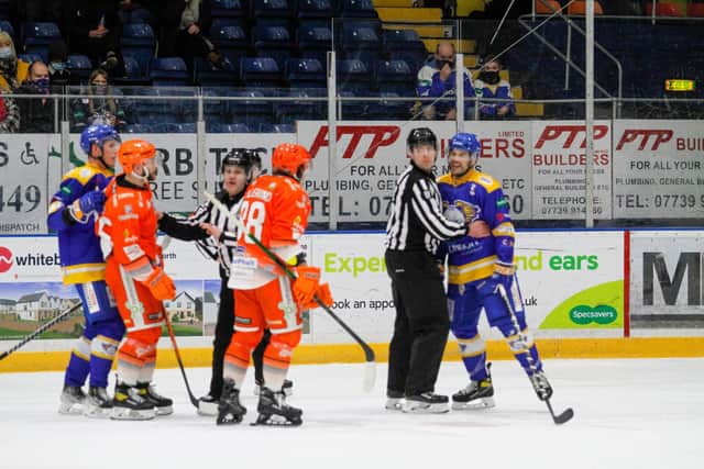 Sheffield Steelers' Robert Dowd, left, and Marco Vallerand discuss a heated point