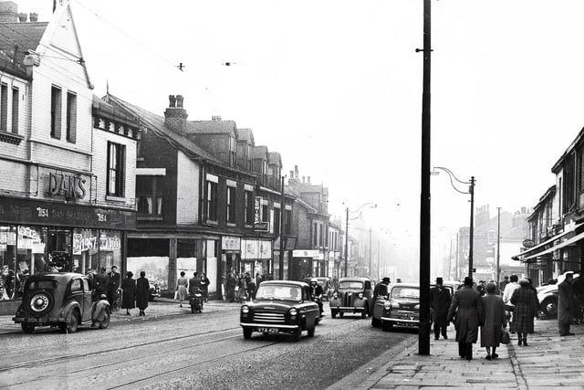 A view along London Road, Sheffield, with the Dan Bradbury motor cycle shop on the left, 1958