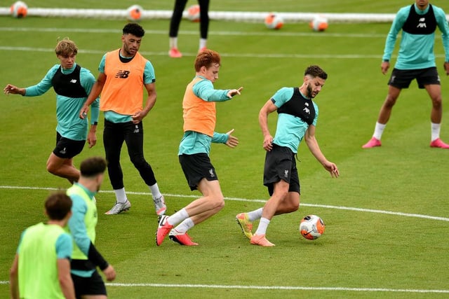 Adam Lallana and Sepp van den Berg of Liverpool during a training session at Melwood Training Ground on July 13, 2020 in Liverpool, England.