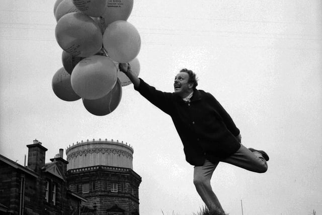 British actor Terry-Thomas releases balloons on Blackford Hill in aid of the Scottish National Institute of War Blinded in April 1960.