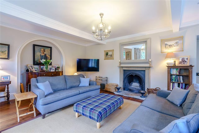 The formal lounge area is spacious in size and is bathed in light from the bay window overlooking the gardens, while a set of double doors lead out to an enclosed walled courtyard.