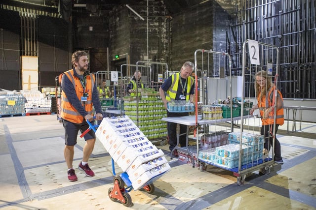 More than 1,000 food parcels a week are now packed by volunteers in the theatre to be given out to people who are shielding