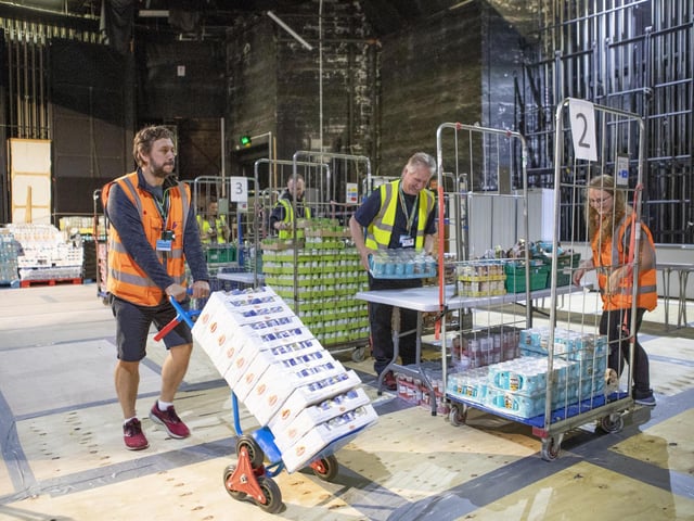 More than 1,000 food parcels a week are now packed by volunteers in the theatre to be given out to people who are shielding