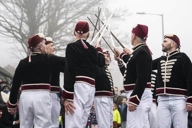 Members of the Handsworth Traditional Sword Dancers perform in Grenosid, a suburb of Sheffield, South Yorkshire. A Longsword dance has been performed after Christmas in the village of Grenosid since the early 1800's. The tradition, that now sees several sword dancing troupes perform alongside traditional morris dancers, usually takes place on Boxing Day, but this year it was the date was moved because boxing day fell on a Sunday.