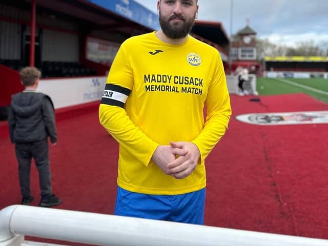 Richard Cusack, Maddy’s brother at the match in a replica kit to the one Maddy wore when she was on the team. Credit: Olivia Cusack