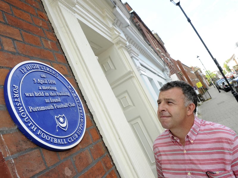 The birthplace of Portsmouth Football is marked with a plaque at 12 High Street, Old Portsmouth where the meeting was held to found the club in 1898
Pictured: Pompey fan Rick Hawkins from Fareham shows an interest in the Portsmouth Football Club plaque
Picture: Ian Hargreaves (141665-4)