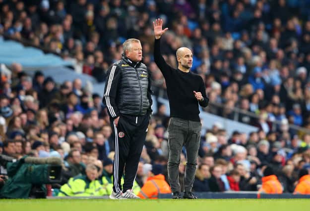 Sheffield United manager Chris Wilder on the touchline alongside his Manchester City counterpart Pep Guardiola during his side's 2-0 defeat at the Etihad Stadium. (Photo by Alex Livesey/Getty Images)