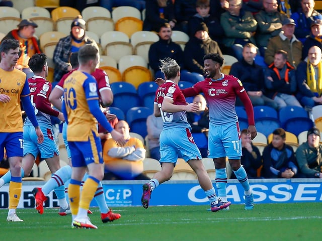 Scunthorpe take the early lead with a Myles Hippolyte penalty.