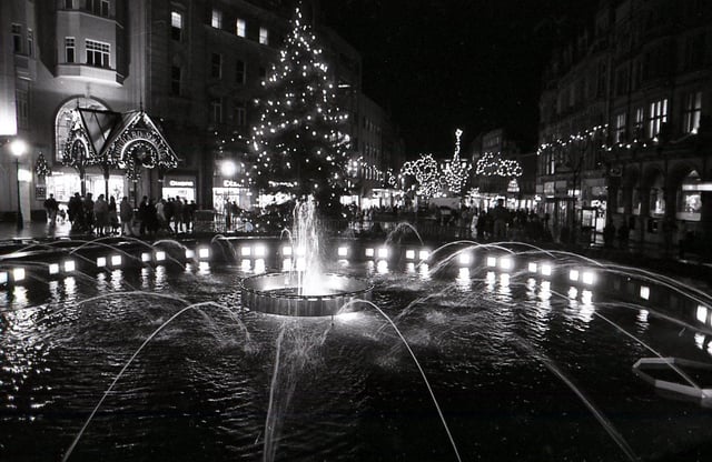 The Christmas illuminations on Fargate in November 1990, showing the lights reflecting in the Goodwin Fountain