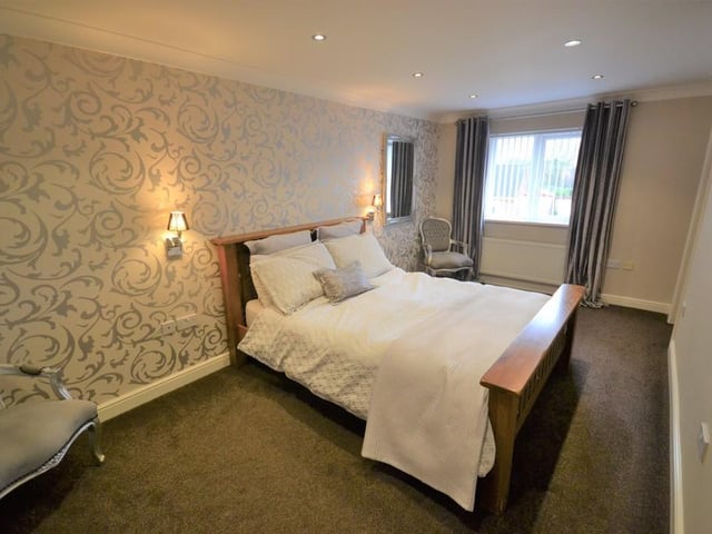 Master bedroom - An impressive generous sized double bedroom enjoying a pleasant outlook from a front facing upvc double glazed window. Having various power sockets, provisions for a wall mounted television. Central heating radiator, an Oak door opens to the ensuite with inset down lighting and coving to the ceiling.