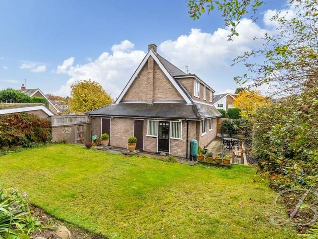 Moving outside now and a look at the back of the Faraday Road property. An enclosed, spacious garden is mainly lawned but also has decorative shrubs and trees.
