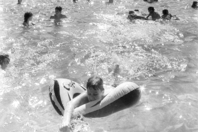 Some of the people enjoying a refreshing dip at  Millhouses Lido, on a sunny day on August 28, 1984.