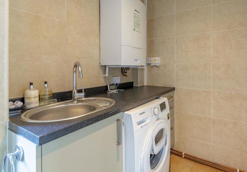 This utility room is a handy, unexpected bonus. It even boasts a pantry.