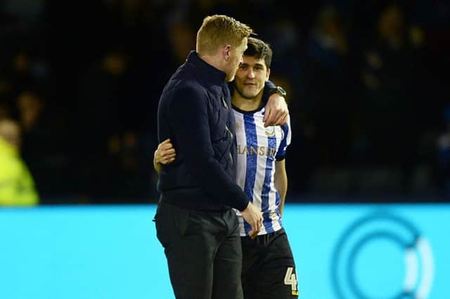Sheffield Wednesday's Fernando Forestieri with Garry Monk arm in arm after a long overdue victory over Charlton on Wednesday. Pic Steve Ellis