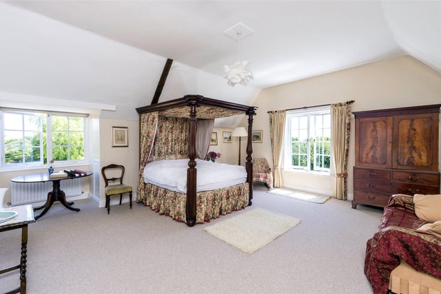 In addition to the generous reception rooms there is a large kitchen/family room complete with open fireplace and large bay window looking out over the surrounding grounds.