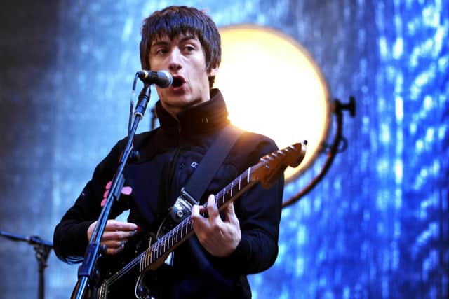 Arctic Monkeys lead singer Alex Turner performing at T in the Park festival, in Balado, Perth and Kinross. A guitar belonging to Arctic Monkeys frontman Alex Turner has raised £128,54 in a charity raffle for grassroots music venues.