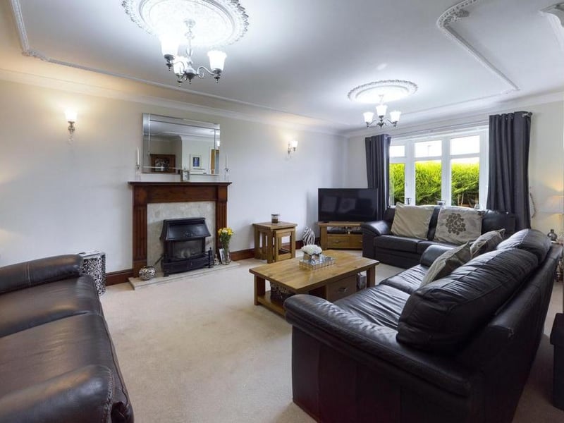 Lounge - uPVC double glazed bow window to the front elevation, ceiling coving, feature fire surround with granite inset and hearth incorporating the outset gas fire, two wall light points, T.V point, two radiator panels and power points.