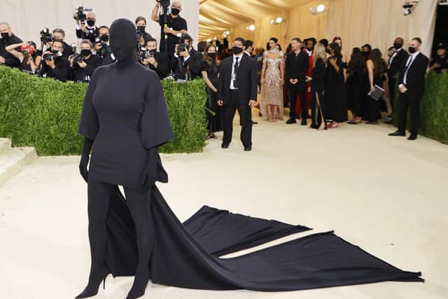 The Keeping Up With The Kardashians star wore a Balenciaga gown and matching mask. (Photo by: Mike Coppola/Getty Images