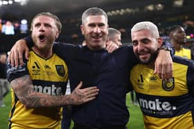 Former Sheffield United midfielder Nick Montgomery (C) celebrates with Jason Cummings (L) and Christian Theoharous (R) of the Mariners after winning the 2023 A-League Men's Grand Final: Cameron Spencer/Getty Images