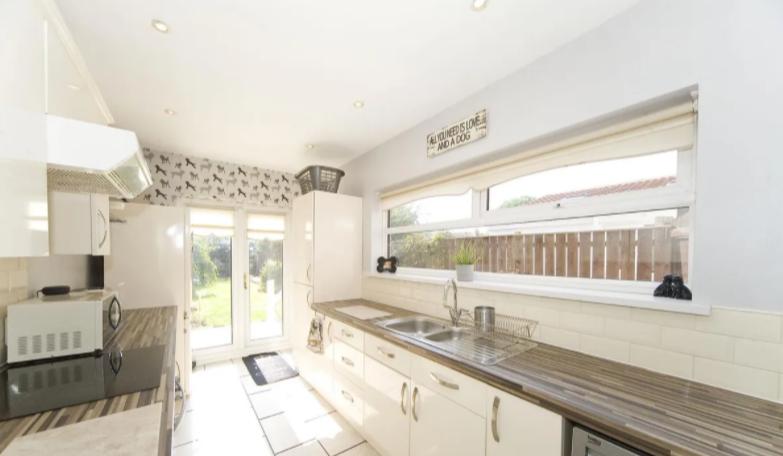 The fitted kitchen has double doors leading to the garden.