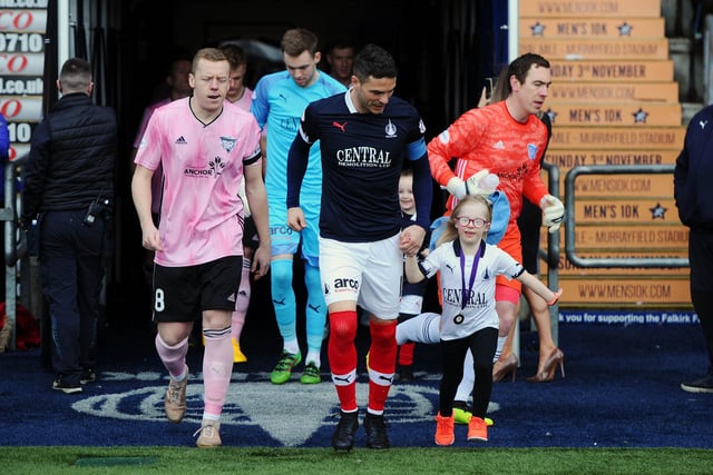 Caitlin Ross leads captain for the day Gary Miller and the Bairns out for kick-off.