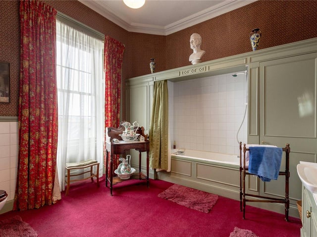 The townhouse benefits from four bathrooms - as you can see in this bathroom, there is a shower over bath fixture and decadent decor throughout the bathroom