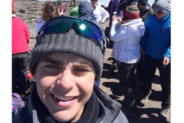 Chris is pictured at the top of Kilimanjaro
