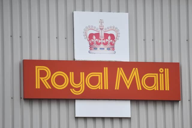 A Royal Mail logo is seen outside a sorting office on February 14, 2021. (Photo by Nathan Stirk/Getty Images)