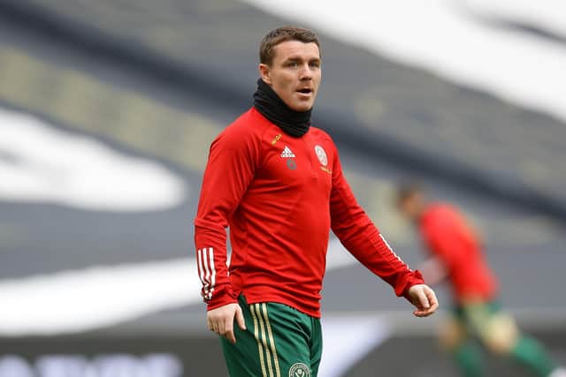 Sheffield United midfielder John Fleck has tested positive for Covid-19 while on international duty with Scotland