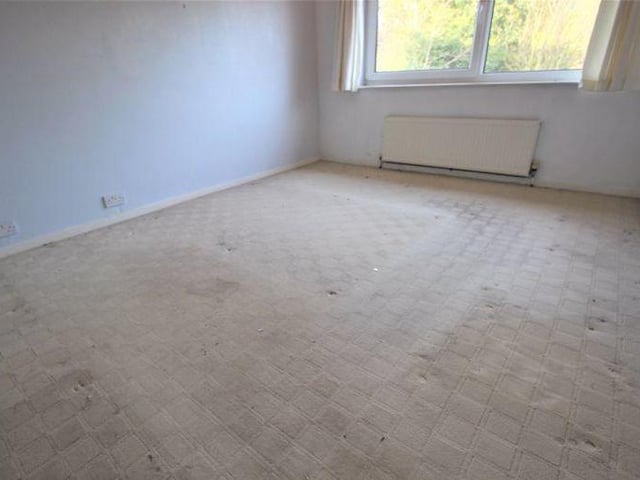 The second bedroom is also a good size, with views looking out on to the back garden. The room boasts a carpeted floor, decorative ceiling-light and radiator.