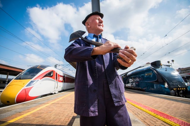 Jim Smith, traction inspector on the Mallard stands between platforms where the famous steam locomotive Mallard (right) stopped at the same time as the new LNER train the Azuma (left) ahead of it's first ever passenger trip between York and Darlington.