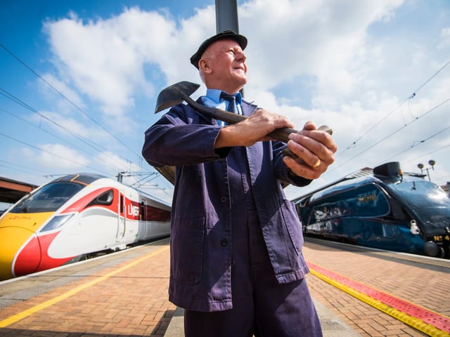 Jim Smith, traction inspector on the Mallard stands between platforms where the famous steam locomotive Mallard (right) stopped at the same time as the new LNER train the Azuma (left) ahead of it's first ever passenger trip between York and Darlington.