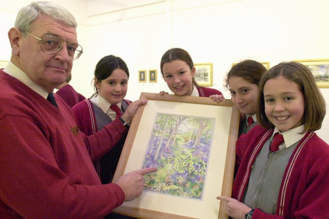 Artist and Gallery Supervisor Tony Martin shows Ashdell School pupils Harriet Baird,Rosanna Marrell,Janine Adamo and Kim Smith some of the work in the new S10   FABLE gallery Broomhill in January 2001