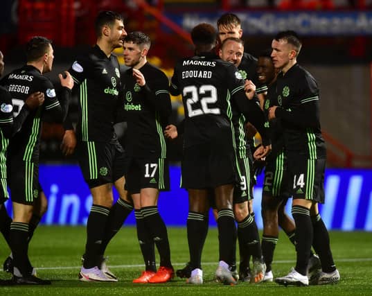 Celtic celebrate the second goal, scored by Leigh Griffiths (Photo by Mark Runnacles/Getty Images)