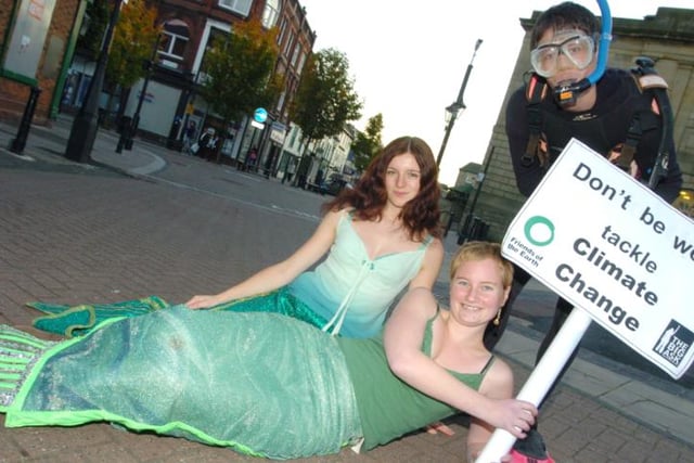 Green Peace protesters outside of the Doncaster Market - one protester is dressed as a mermaid.