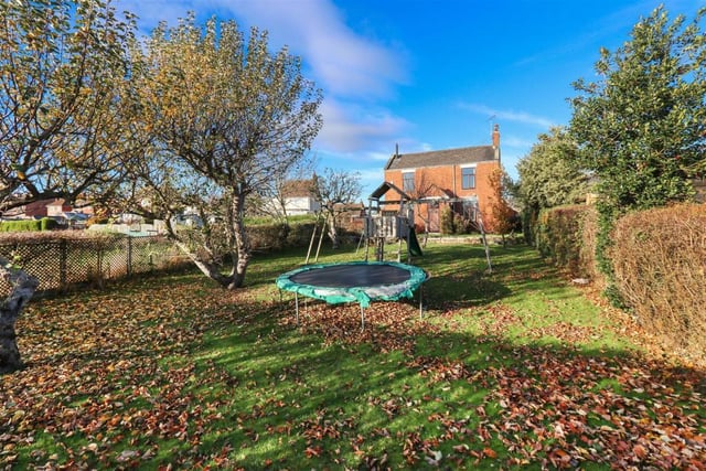 The enclosed lovely front garden makes it the perfect play area for a family.