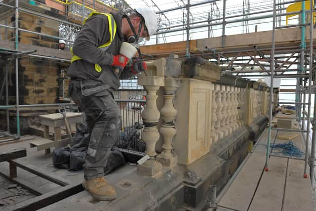 Heritage Stonemasons working on the ballustrades, statues and chimneys on the roof