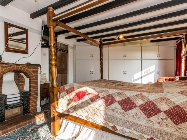 This bedroom has room for a large four poster bed and fitted wardrobes.