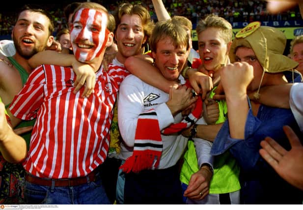 Sheffield United manager Dave 'Harry' Bassett is mobbed by jubilant Blades fans after their side clinched promotion with a 5-2 win at Leicester City on May 5 1990.