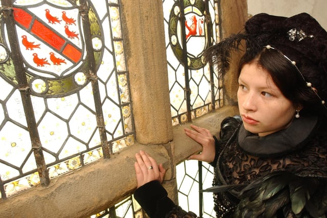 Karen Castelblanco as Mary Queen of Scots peered through the window at Manor Lodge to promote their upcoming Open Day in 2004