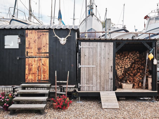 There is a small entrance yard, where the owners have built a shepherd’s hut and wood store.