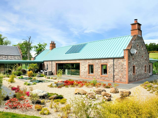 Surrounding the property are both paved and gravelled terraces, areas for al fresco dining, a rock garden within the courtyard, and an open barbecue area beside the lake.