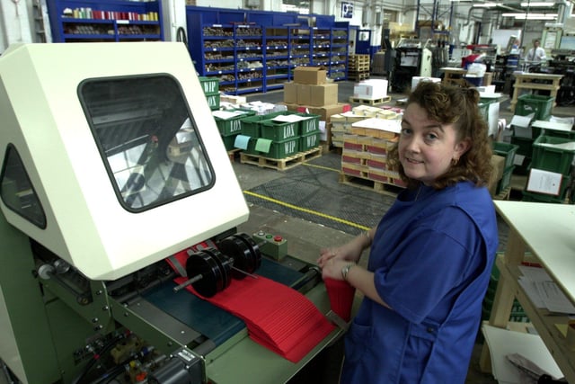 Lisa Deehan at work on the folding machine at Loxley Print