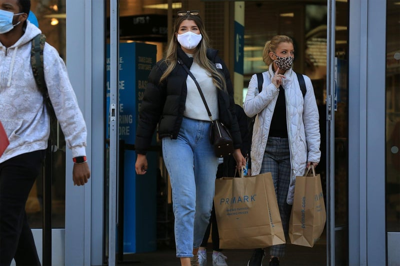 Visitors with their Primark shopping bags.