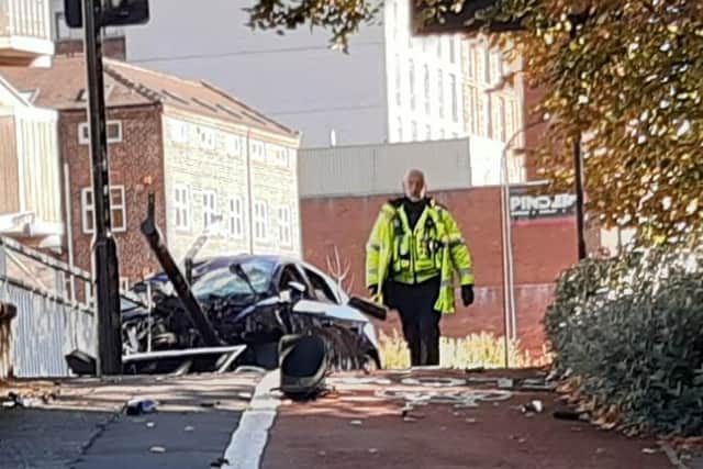 The damaged car at Moore Street, in Sheffield city centre, which was closed after a serious car crash last night