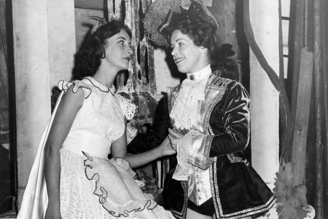 The Lyceum pantomime has been a favourite for decades - Prince Valiant (Mary Harkness) serenades Red Riding Hood (Barbara Haydn) during the dress rehearsal at the theatre in December 1955