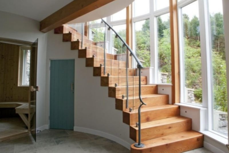 Hand-crafted wooden stairs take you up to the bedrooms.