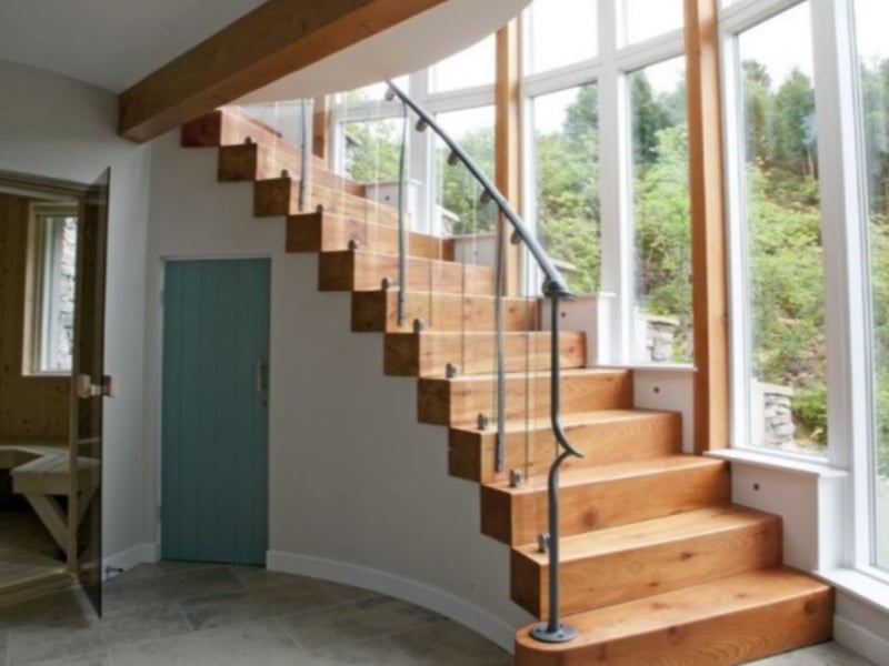Hand-crafted wooden stairs take you up to the bedrooms.